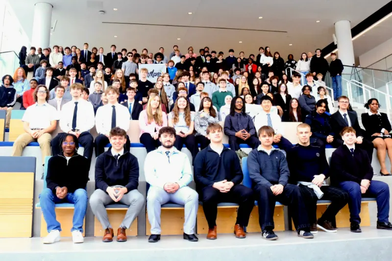 School groups line the steps for photos